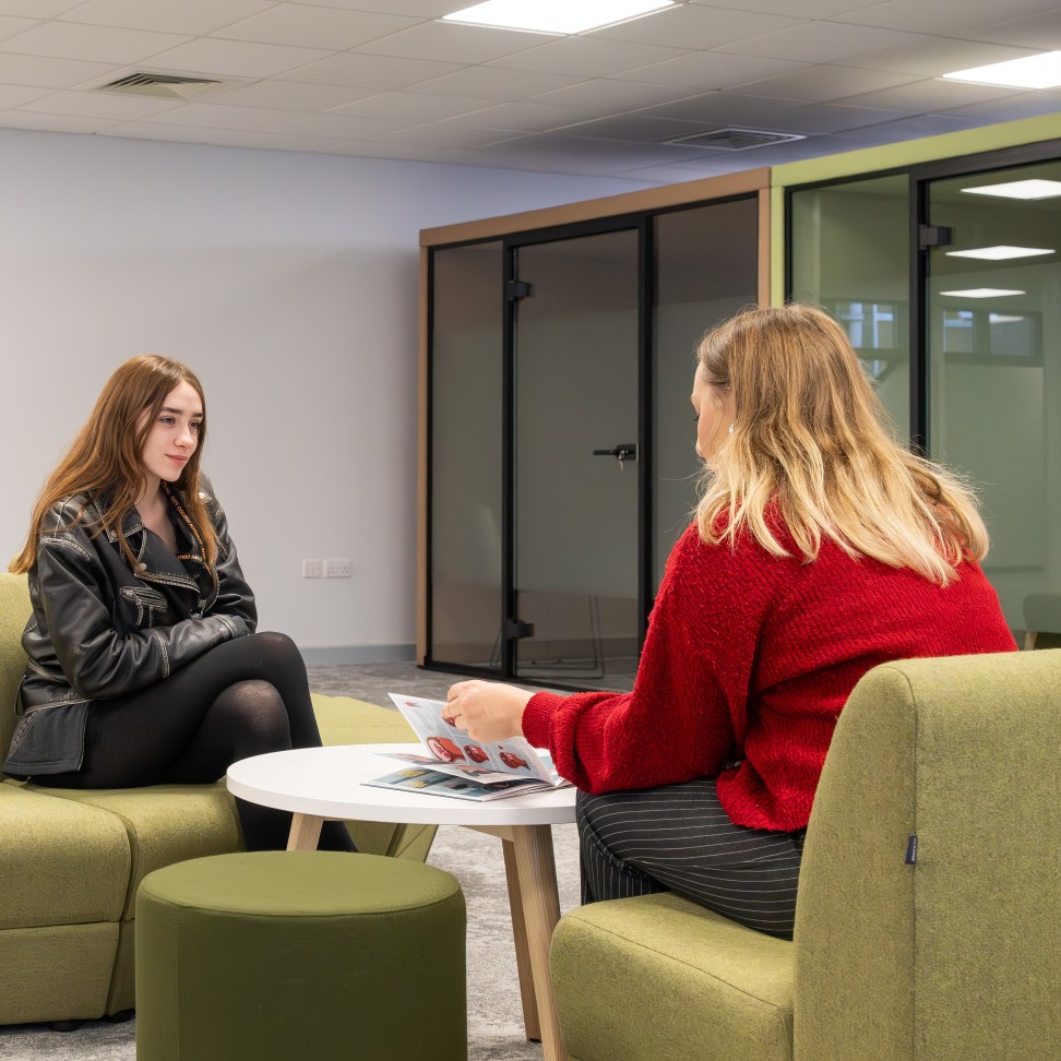 Wellbeing drop-in session happening between a student and support staff member